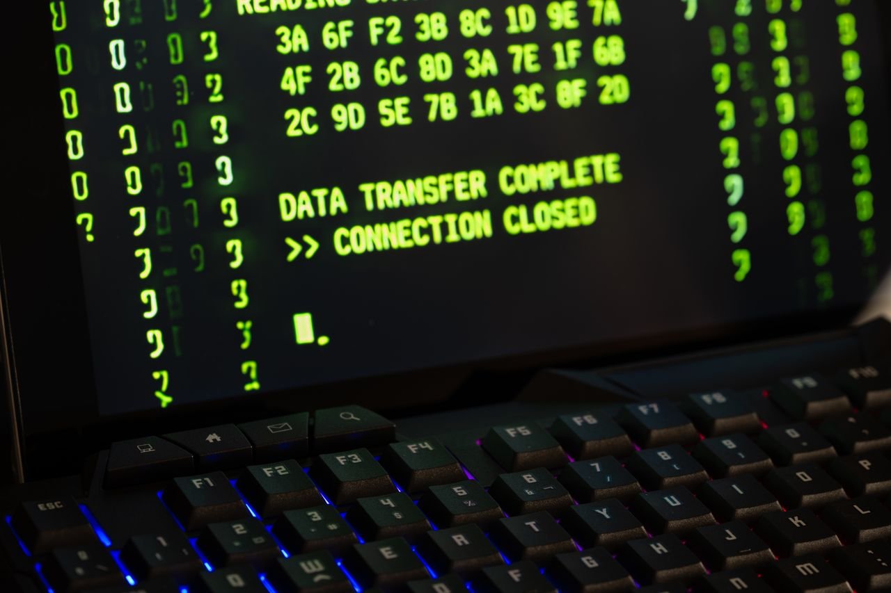 Home Data transfer complete message displayed on a computer monitor with a keyboard underneath.